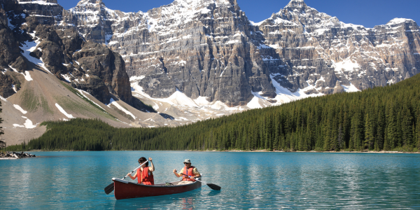 two kayakers in the canadian rockies
